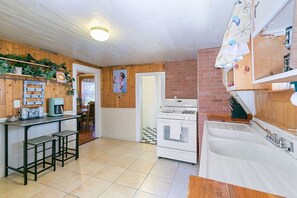 Fridge, coffee/tea maker, cookware/dishes/utensils