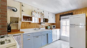 Fridge, coffee/tea maker, cookware/dishes/utensils