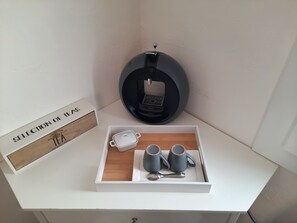 Enjoy a perfectly organized space with a selection of tea and a convenient coffee maker.