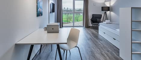 City Studio | Premium bedding, laptop workspace, blackout curtains, soundproofing