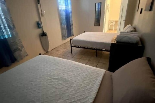 1 bedroom with two full beds for up to 4 people. Bedroom is equipped with an 18,000 Inverter Air Conditioned.