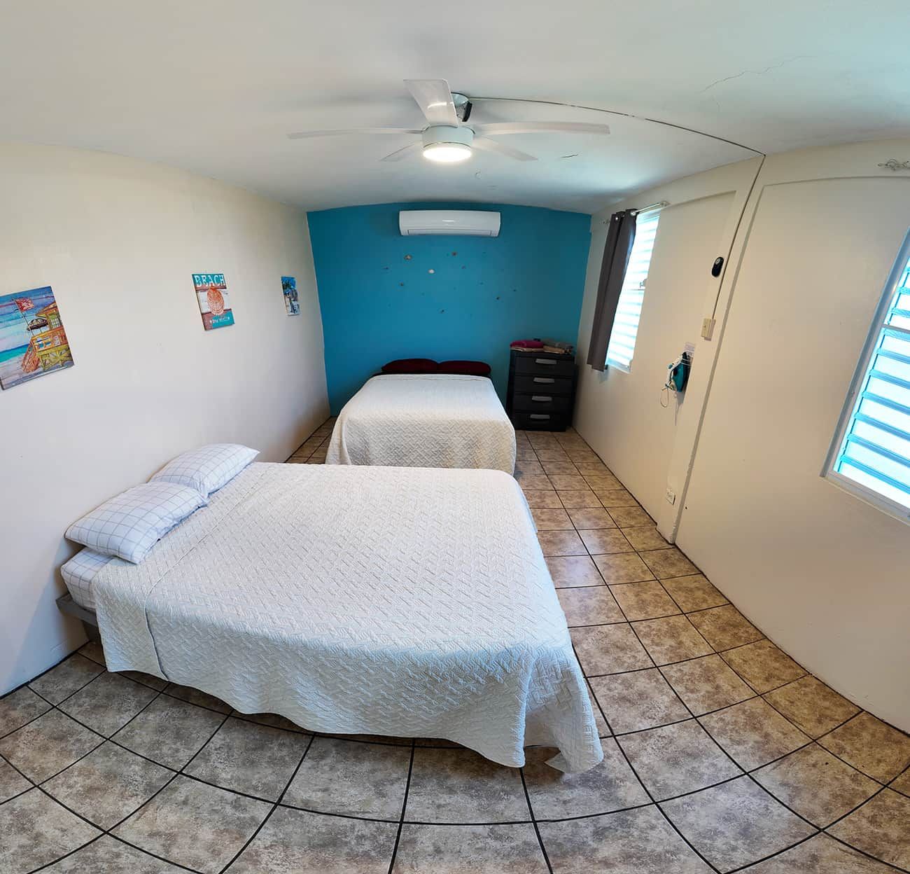 1 Bedroom with two full beds to accommodate uptown 4 people. Bedroom is equipped with a 18,000 A/C.