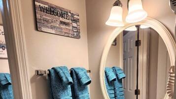 Bathtub, hair dryer, towels