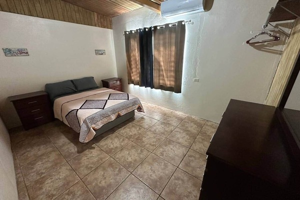 1 bedroom with 1 full size bed and an inverter air conditioned.