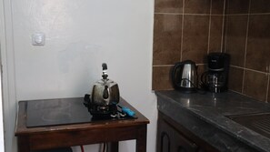 Fridge, cookware/dishes/utensils, spices, lobster pot