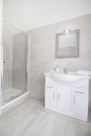 Shower, hair dryer, towels, soap