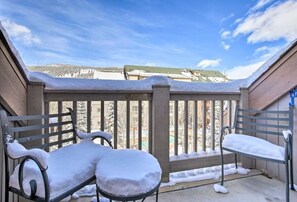 Enjoy the serene views of the surrounding hills from this balcony.