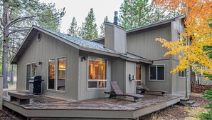 A modern cabin with a deck, large windows, and a chimney. - 5 Wickiup 3 Bedroom Home by RedAwning (Bend)