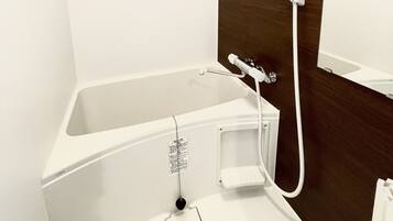 Hair dryer, towels, shampoo, toilet paper