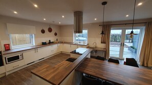Private kitchen - Luxury accessible holiday accommodation with a hot tub and hoists. (Banwell)