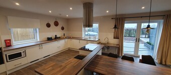 Luxury accessible holiday accommodation with a hot tub and hoists.