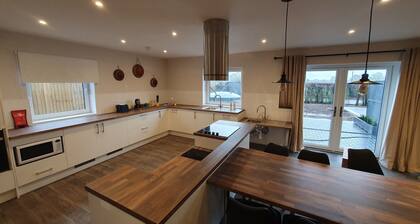 Luxury accessible holiday accommodation with a hot tub and hoists.