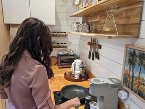 Fridge, microwave, stovetop, coffee/tea maker