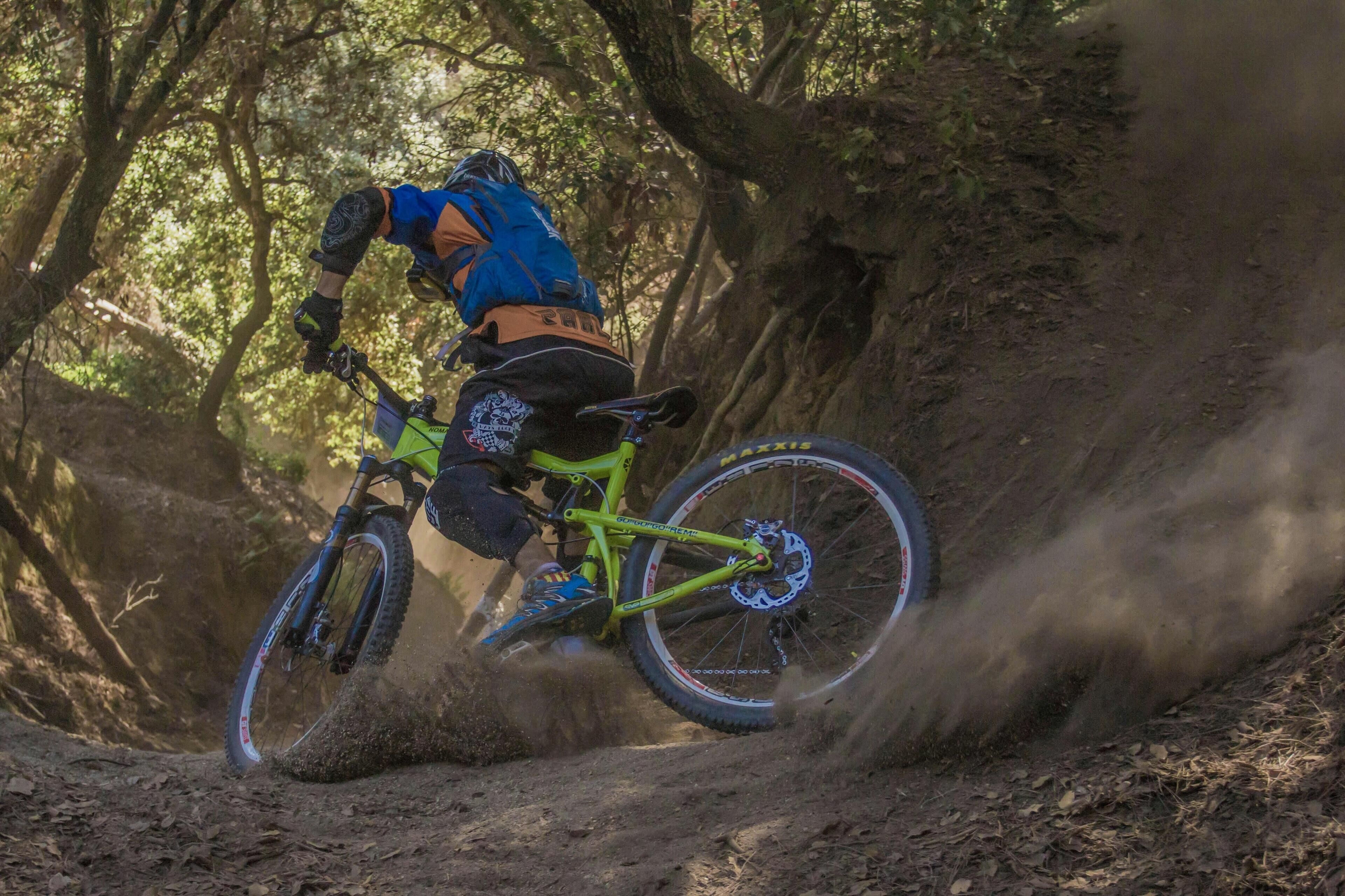 A mountain biker navigating a dirt trail.