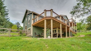 A large, two-story house with a wooden deck and a covered porch. - 6 Mi to Dtwn Parker: Serene Studio Suite! (Parker)