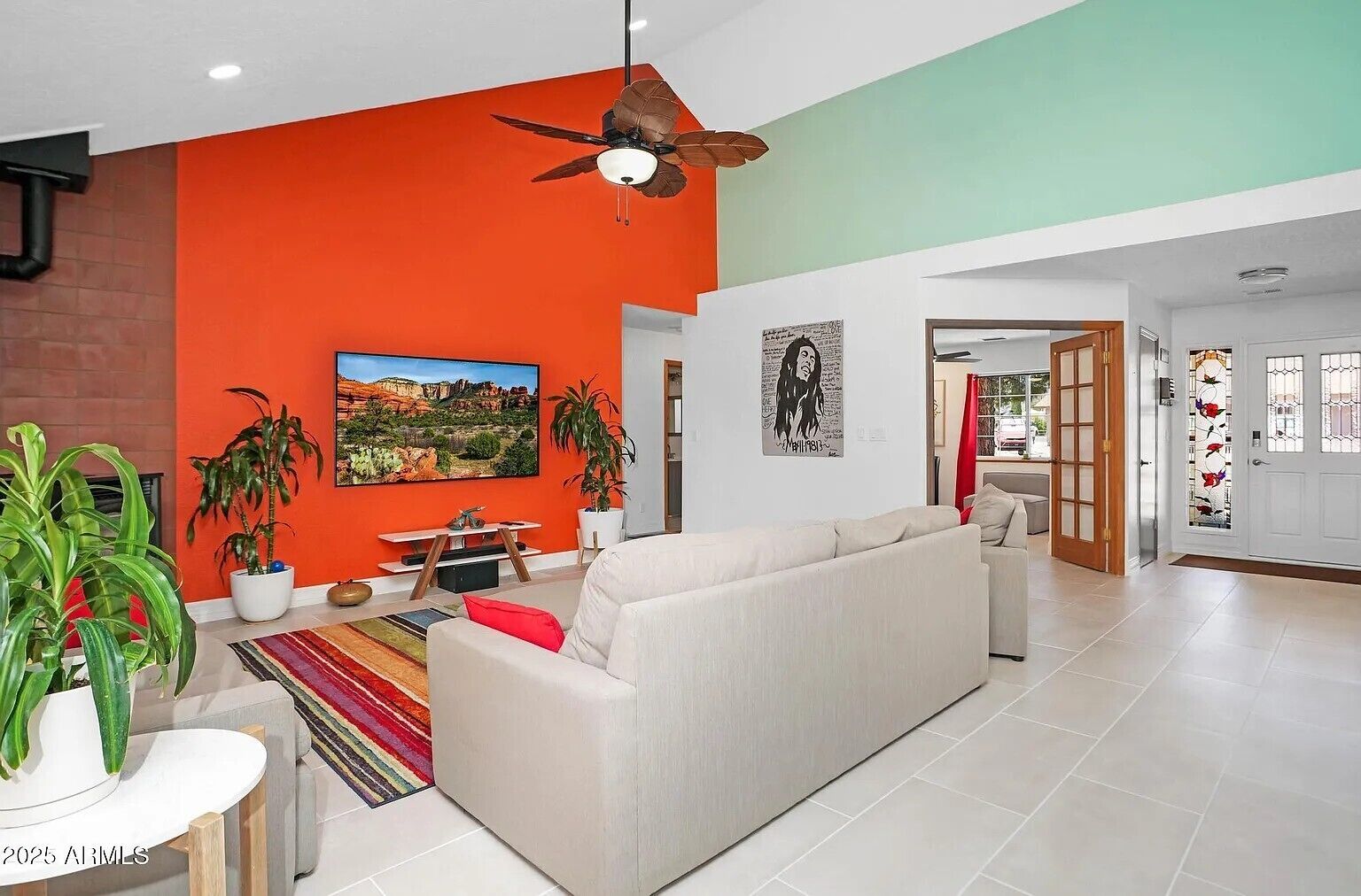 Smart TV, fireplace, books, computer monitors