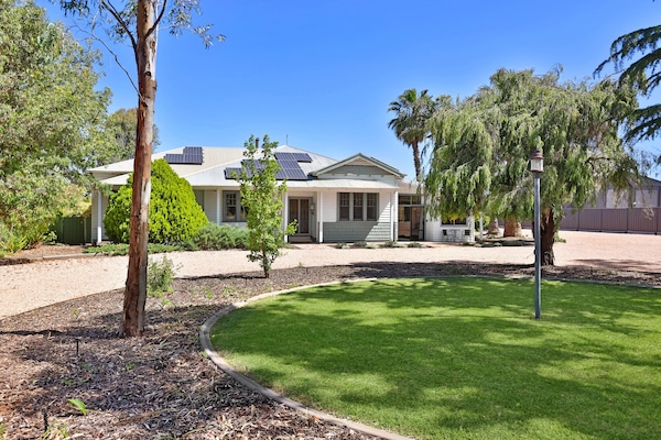 Plenty of shady parking, including large area on the right of the house