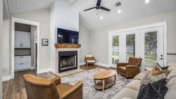 TV, fireplace, books, offices