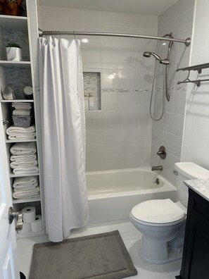 Shower, hair dryer, towels, soap
