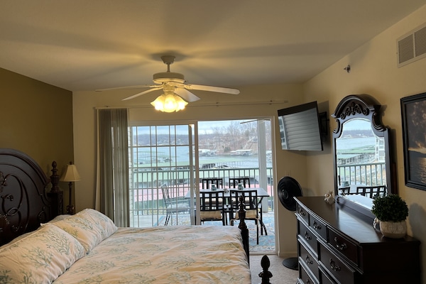 Master with attached bath and view