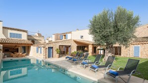 A pool area with lounge chairs and a stone building. - CAN FONT (COSTITX) - Stunning villa with private pool and free WiFi. (Costitx)