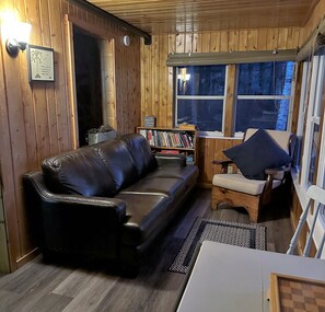 TV, fireplace - Stowaway Cottage Lakefront Property on Ambajejus Lake, Near Baxter State Park (Millinocket)