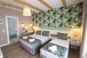 Chambre Deluxe Double ou avec lits jumeaux | Draps en coton égyptien, literie de qualité supérieure, minibar