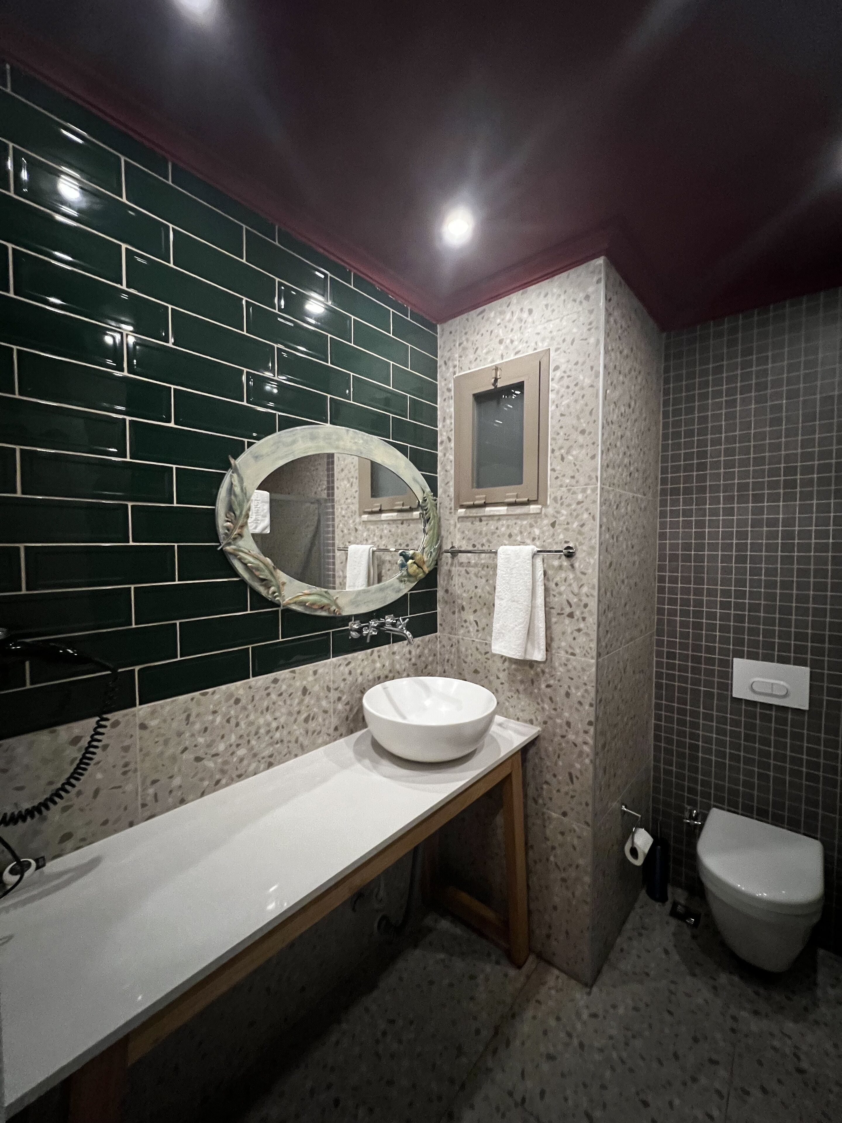 deluxe double or twin room | bathroom | shower, rainfall showerhead, hair dryer, slippers