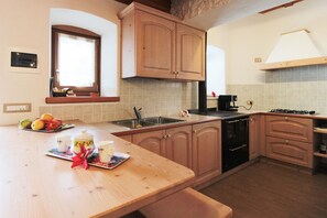 Fridge, stovetop, espresso maker, coffee/tea maker