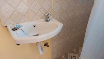 Slippers, towels, soap, toilet paper