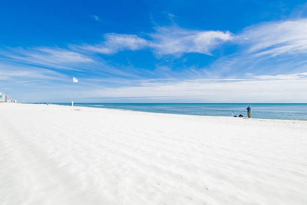 Guests can enjoy a serene beach experience with expansive views and a tranquil atmosphere.