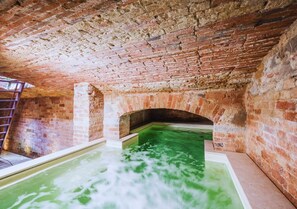 A swimming pool with a brick interior and a clear water surface. - Country House with heated pool near the center (Firenze)