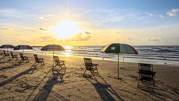 On the beach, sun loungers, beach towels