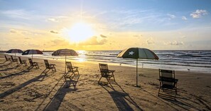 On the beach, sun-loungers, beach towels