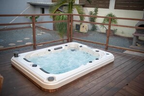 Relax in a hot tub with multiple jets for a soothing experience.