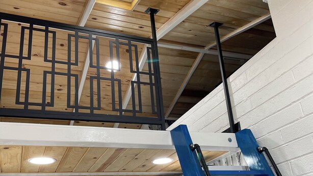 A wooden ceiling with skylights and a metal railing. - The Birds Nest in Central Phoenix (Phoenix)