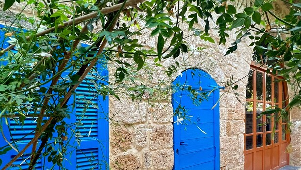 A stone building with blue shutters and a wooden door. - Ultimate experience of living in a traditional Legacy with a natural setting (Sidon)
