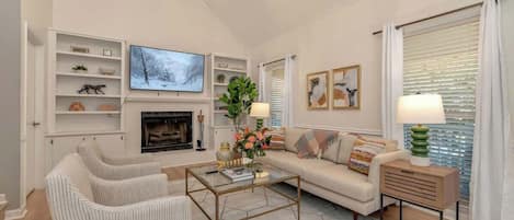 TV, fireplace, books, offices