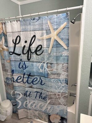 Shower, hair dryer, towels, toilet paper
