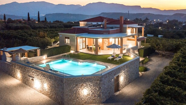 A modern two-story house with a swimming pool, outdoor seating, and a view of mountains. - Cretan Vineyard Hill Villa 2 | Private pool, panoramic view, beautiful vineyard (Άνω Καλεσια)