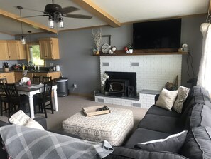 Living room with fireplace and TV (cable, netflix, and blueray player with DVDs)