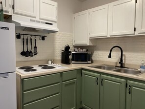 Fridge, microwave, stovetop, coffee/tea maker