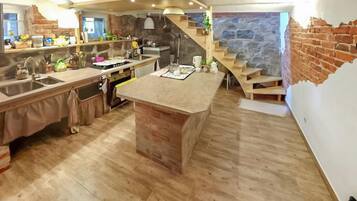 Fridge, stovetop, dishwasher, coffee/tea maker