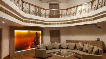 Family Quadruple Room | Living area | 42-inch LCD TV with digital channels, TV, pay films