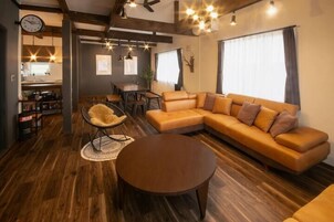 Villa | Living area | 50-inch flat-screen TV with digital channels