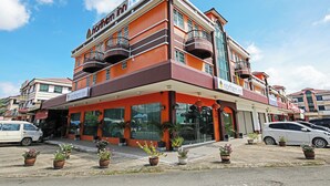 A multi-story building with a prominent 'Northern Inn' sign, featuring balconies and large windows. - Hotel O Northern Inn (Kota Marudu)