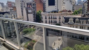 A cityscape with a mix of modern and historic buildings, a clear sky, and a view from a high-rise balcony. - Bright and cozy studio in the heart of Recoleta (Buenos Aires)