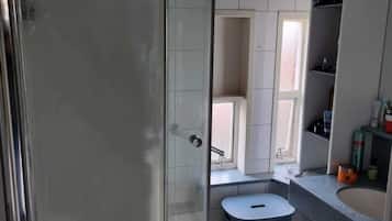 Shower, towels, toilet paper