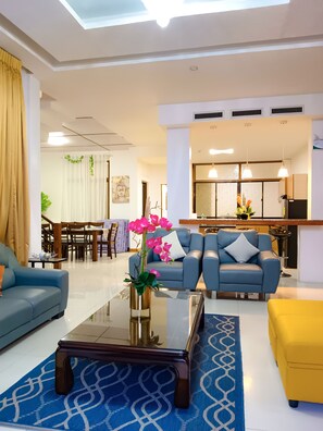 Grand Villa, 4 Bedrooms | Living area | 40-inch LED TV with digital channels, TV - Laciaville Resort Hotel (Lapu-Lapu)
