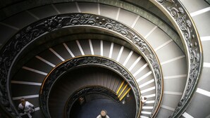A spiral staircase with ornate metal railings and a central column. - Maria in Vaticano (Rome)
